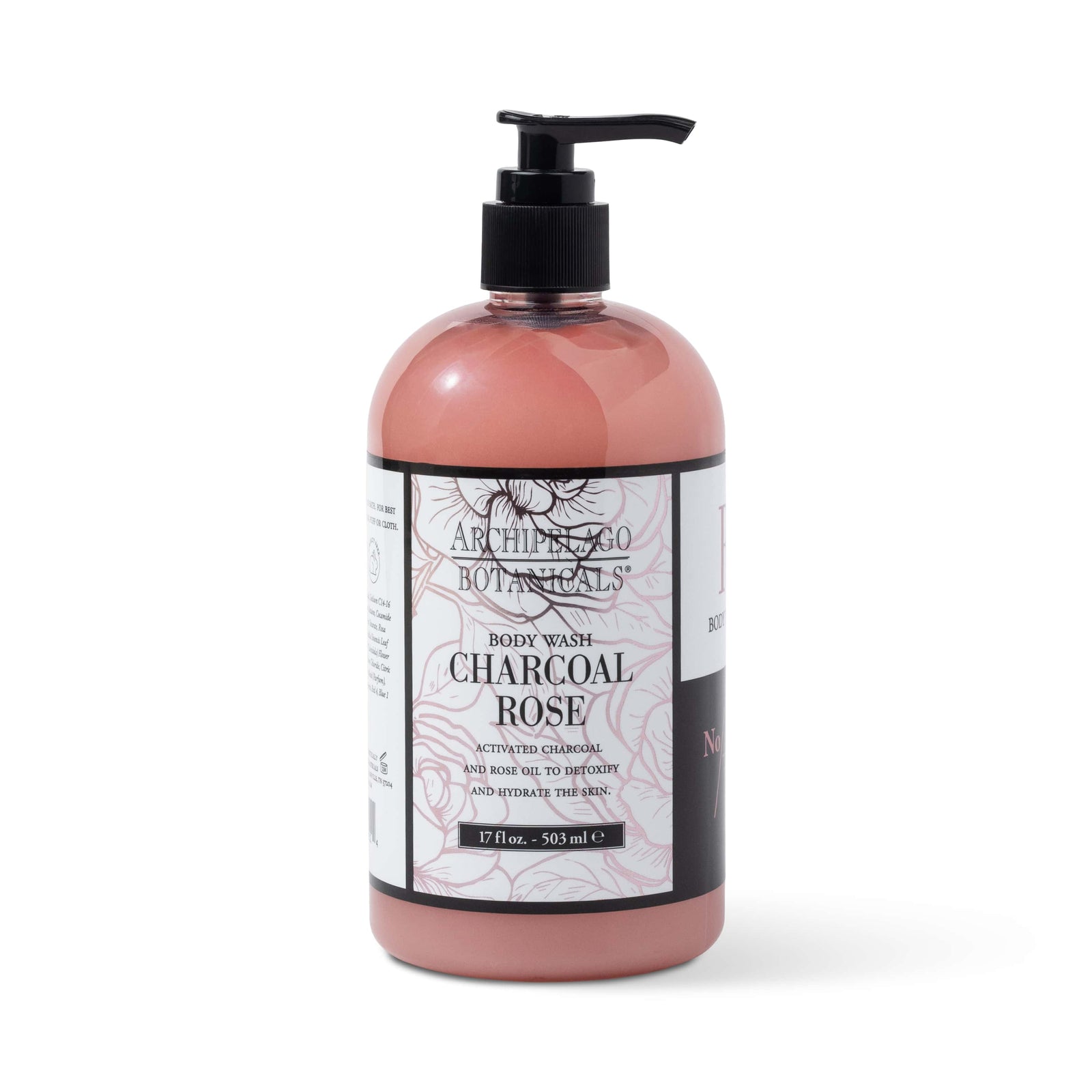 The Charcoal Rose 17 oz. Body Wash features a black pump dispenser and pink label with black floral designs, infused with activated charcoal for a refreshing cleanse. Part of the rose bath and body line. - image 1