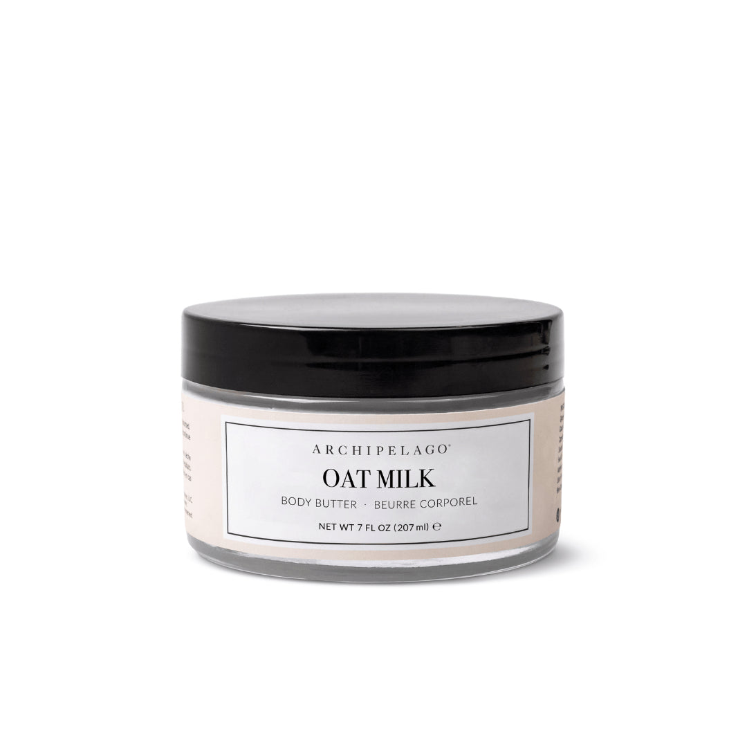 A 7 fl oz (207 ml) white jar of Oat Milk Body Butter with a black lid and a white label featuring black text. - image 1