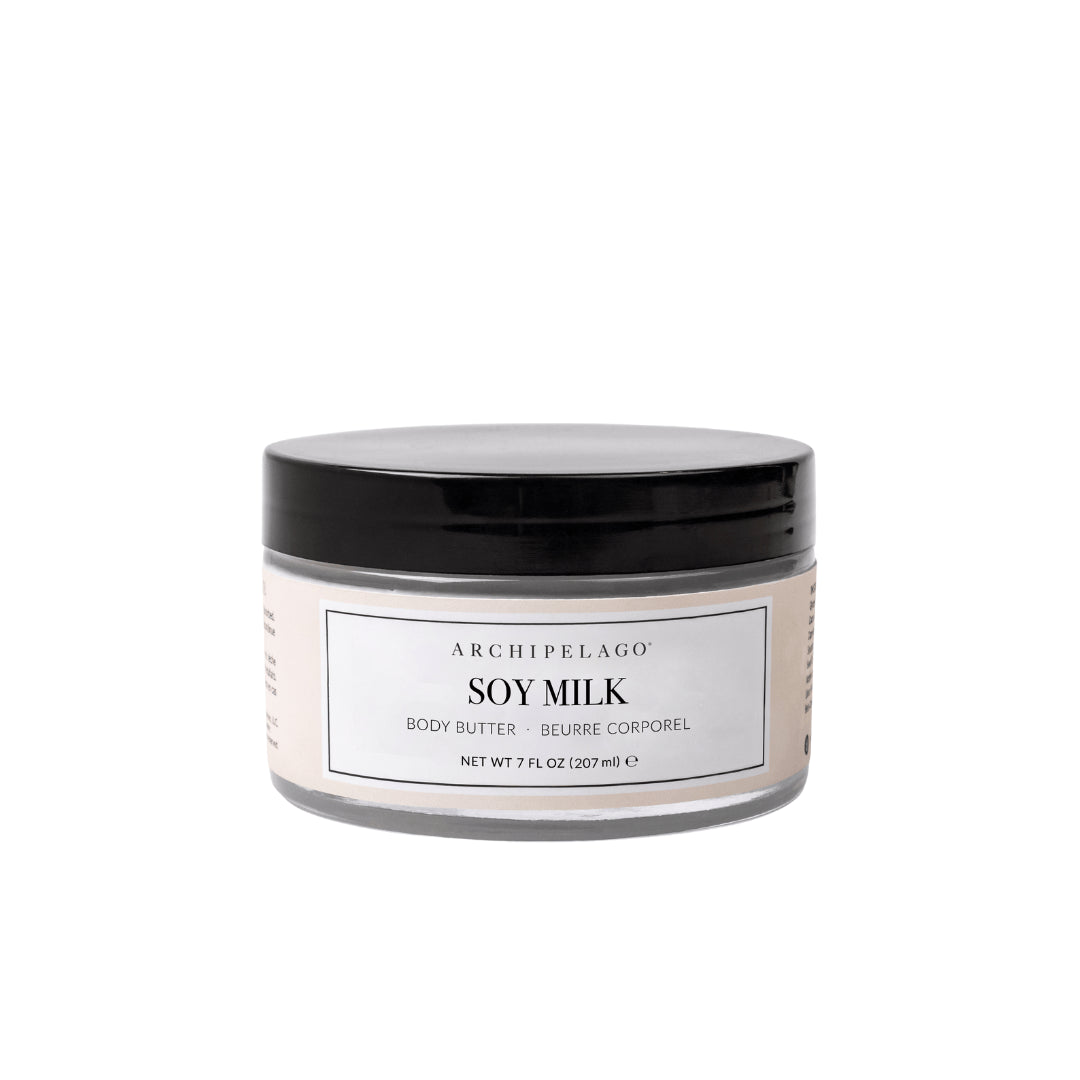 A clear plastic jar with a black lid holds Soy Milk Body Butter, designed for nourishing skin hydration. The label shows the product name and size, 7 fl oz (207 ml), set against a plain white background. - image 1