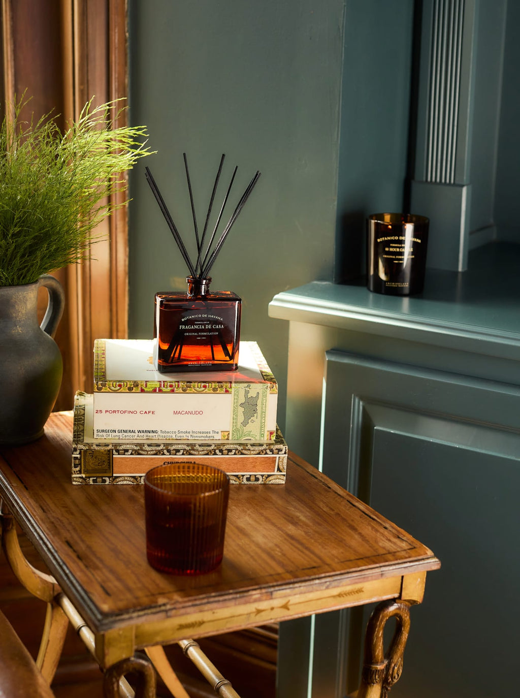 Botanico de Havana Diffuser and Candle on a side table.
