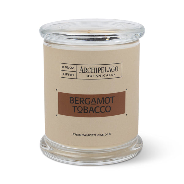 The Bergamot Tobacco Jar Candle is an 8.62 oz clear glass soy wax candle with a beige Archipelago Botanicals label reading Italian Bergamot & Tobacco Flower.