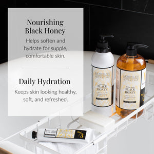 Two bottles of Black Honey Body Lotion and a small tube are arranged on a white bath tray over the bathtub. The scene highlights the lotion’s nourishing and daily hydrating benefits for soft, healthy skin. Against a black tile backdrop, the display enhances the luxurious appeal of Black Honey Body Lotion.6