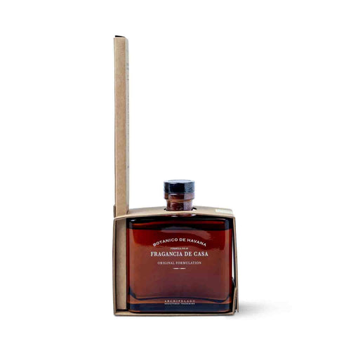 A square brown glass bottle labeled Botanico de Havana Reed Diffuser with a black cap and minimalist cardboard packaging features a signature scent inspired by premium natural ingredients.