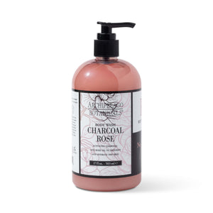 The Charcoal Rose 17 oz. Body Wash features a black pump dispenser and pink label with black floral designs, infused with activated charcoal for a refreshing cleanse. Part of the rose bath and body line.1