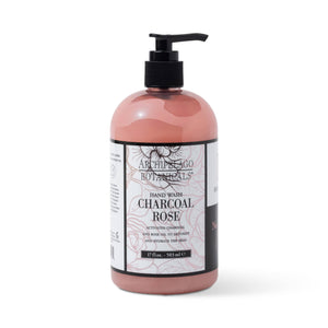 A bottle of Charcoal Rose Hand Wash features a black pump, pink liquid with Activated Charcoal, and a white label highlighting this gentle and nourishing hand wash.1