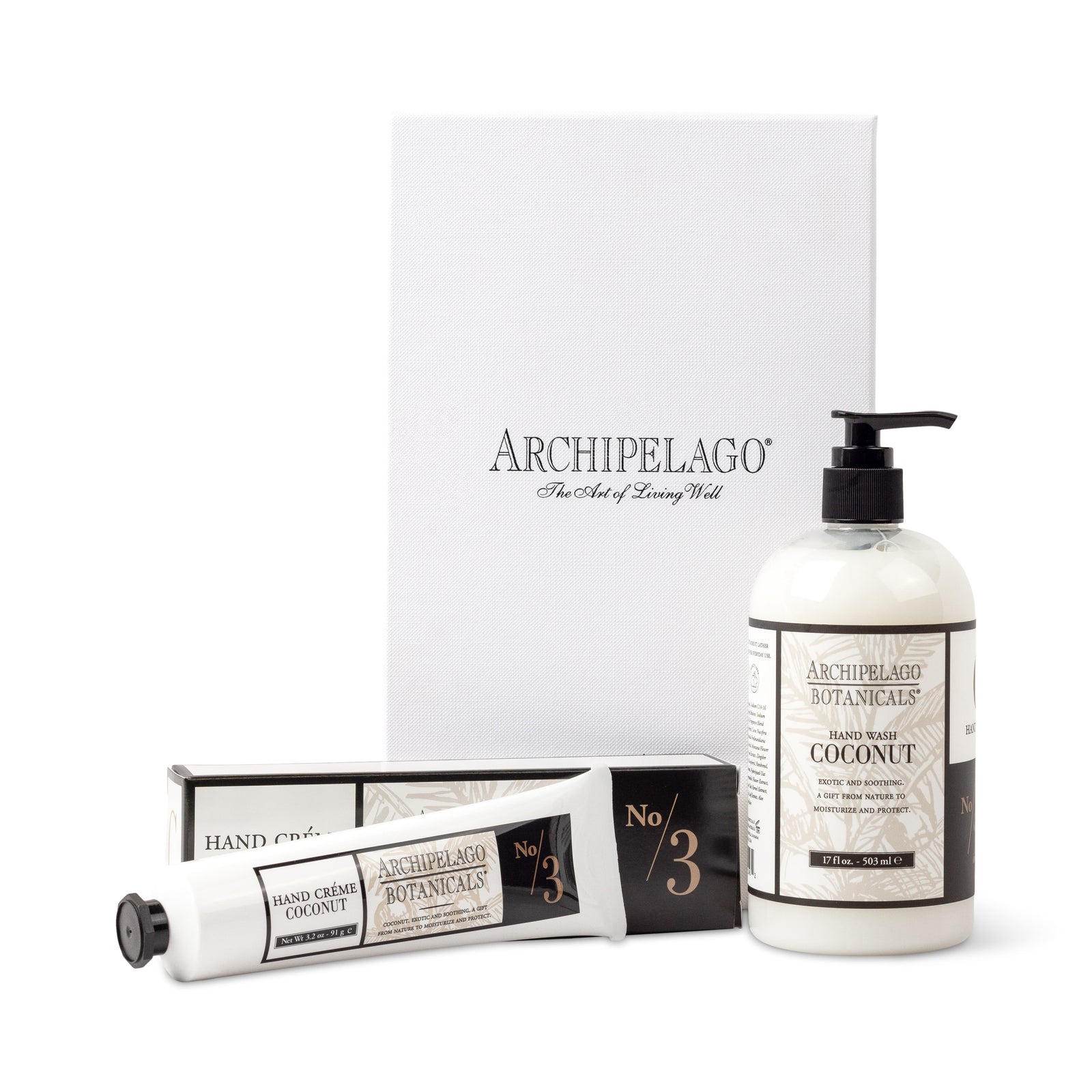 Coconut Hand Care Gift Set in a white box includes a pump bottle of Coconut Hand Wash and a tube of Coconut Hand Crème, both infused with coconut oil and featuring black and white labels. - image 1