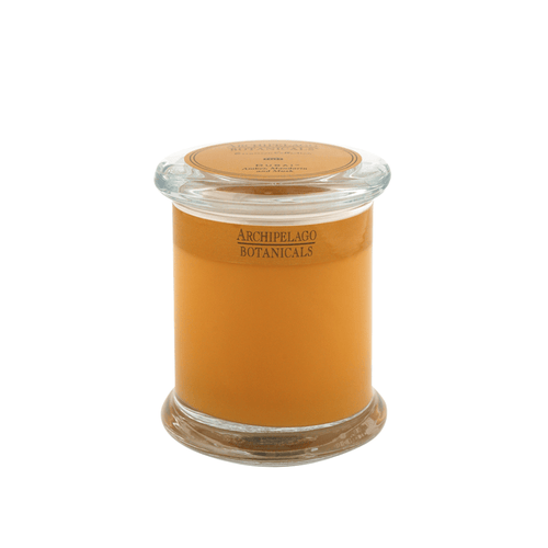 The Dubai Jar Candle features orange-brown wax in a glass jar with a clear lid—ideal for adding handcrafted style and elegant home fragrance to any space.