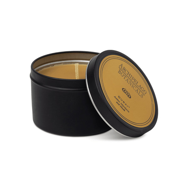 Black candle tin with a brown label on a white background