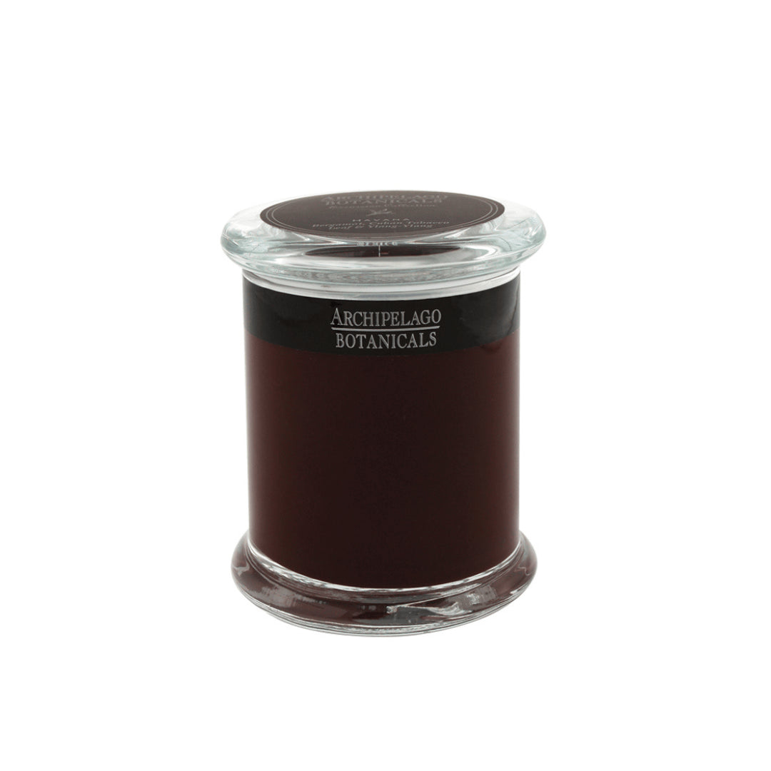 A dark red Havana Jar Candle by Archipelago Botanicals sits in a clear apothecary jar with a flat glass lid, displayed against a plain white background.1