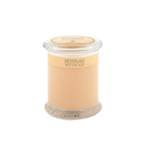 A beige Kashmir Jar Candle in a clear glass jar with a lid, labeled "Kashmir Jar Candle" by Archipelago Botanicals on the front and top.1