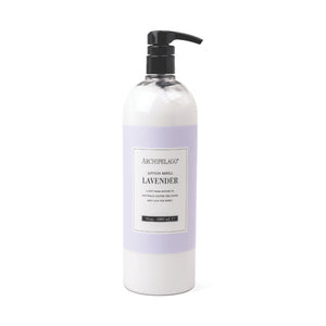 A large bottle of Lavender Lotion Refill with a pump dispenser, featuring a pale purple label with black text on a white background.1
