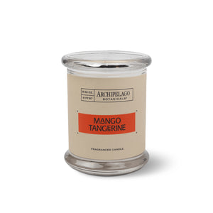 The Mango Tangerine Jar Candle, with a clear glass jar, tan label with orange stripe, and citrus-scented soy wax blend, is shown against a white background.1