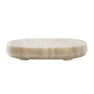 The Marble Soap Dish features an oval, beige marble design with a smooth surface and short, round feet, shown from the side against a white background—an elegant accessory for any spa-like bathroom.1