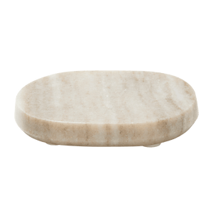 The Marble Soap Dish is beige, oval-shaped, and features a smooth surface with subtle natural veining for an elegant, spa-like look. Shown on a white background.2