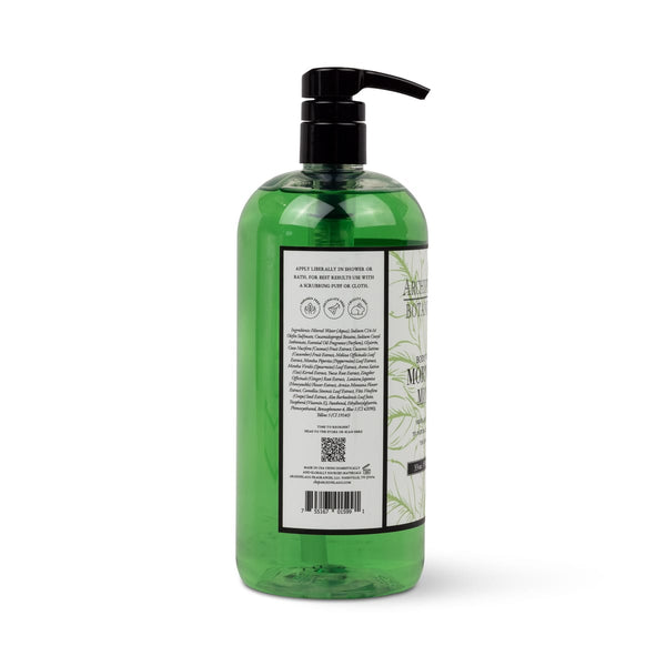 A tall cylindrical bottle of Morning Mint 33 oz. Body Wash with a black pump dispenser and a label showing fresh basil ingredients and instructions.