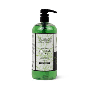 Large clear plastic bottle of Morning Mint 33 oz. Body Wash with a black pump dispenser and a label featuring notes of wild mint and fresh basil. - image 1