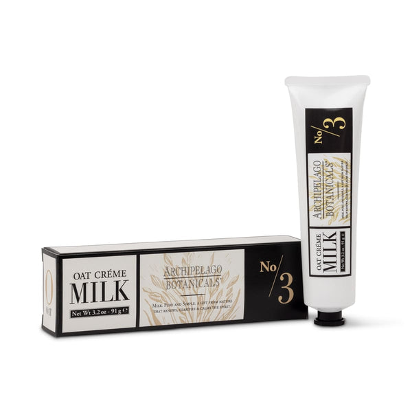 A tube of Oat Milk Hand Creme next to its matching rectangular box, both featuring black and cream packaging with oat stalk illustrations and the text No/3.