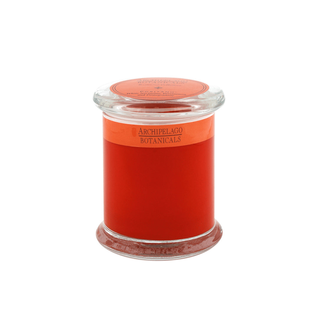 The Positano Jar Candle features a red soy wax in a clear glass jar with a matching lid. Infused with essential oils, this Archipelago Botanicals candle adds style and soothing fragrance to any space.1