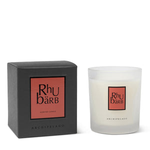 The Rhubarb Boxed Candle, a hand-poured white candle with a rhubarb scent, comes in a frosted glass container and includes black box packaging, both featuring the Archipelago label in bold red and black design.1