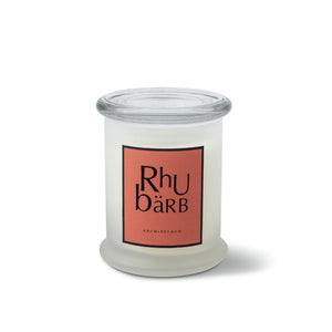 The Rhubarb Frosted Jar Candle is a hand-poured candle in a white frosted jar with a clear glass lid and coral label featuring "Rhubarb" and "Archipelago" in black, displayed against a plain white background.1