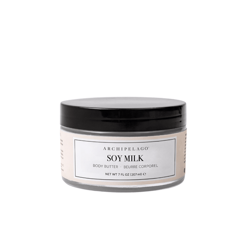 A clear plastic jar with a black lid holds Soy Milk Body Butter, designed for nourishing skin hydration. The label shows the product name and size, 7 fl oz (207 ml), set against a plain white background.