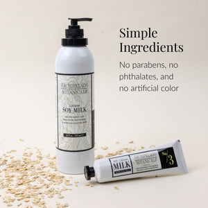 Two Soy Milk Body Lotion bottles from Archipelago Botanicals on a light surface, surrounded by oats. Text reads: Simple Ingredients. Our Soy Milk Body Lotion is cruelty-free, with no parabens, no phthalates, and no artificial color.2