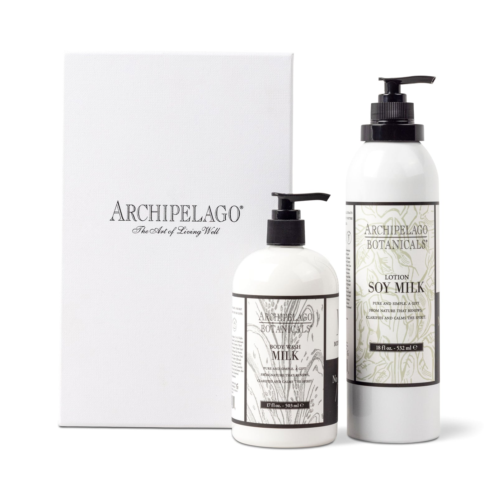 Two white Archipelago Botanicals bottles—Soy Milk Body Wash and Soy Milk Body Lotion—stand beside a white Soy Milk Daily Ritual Gift Set box featuring the logo and “The Art of Living Well” on the front. - image 1