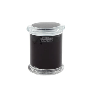 A handcrafted Stonehenge Jar Candle in a clear glass jar with a matching lid features a dark-colored wax and an Archipelago Botanicals label on the front.1