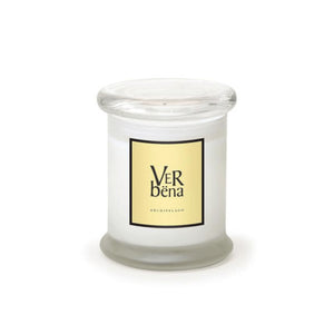 The Verbena Frosted Jar Candle is a white candle in a clear apothecary jar with a flat lid. Its label displays "Verbena" and "Archipelago" in black on pale yellow, and it's infused with essential oils for a calming touch.1